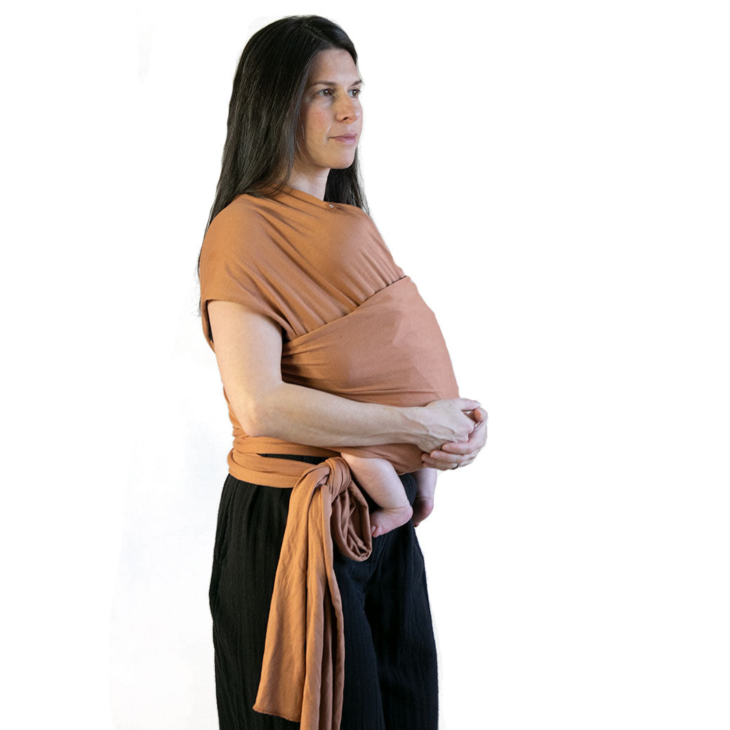 Modern Nursery organic cotton baby wrap for secure babywearing.