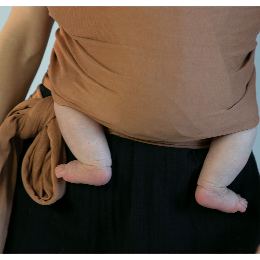 Modern Nursery organic cotton baby wrap for comfortable infant carrying.