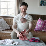 Modern Nursery organic cotton baby wrap, soft and breathable.