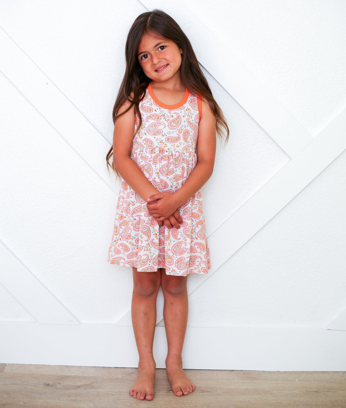 Paisley print sleeveless racerback toddler dress in pink tones