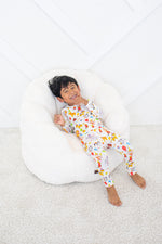Two-piece long sleeve baby pajama set in a party animals print with matching pants