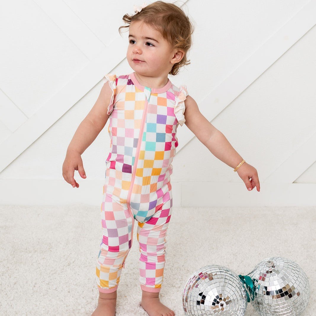 Baby coverall in a soft pastel checked pattern with a full-length front zipper and footed legs.