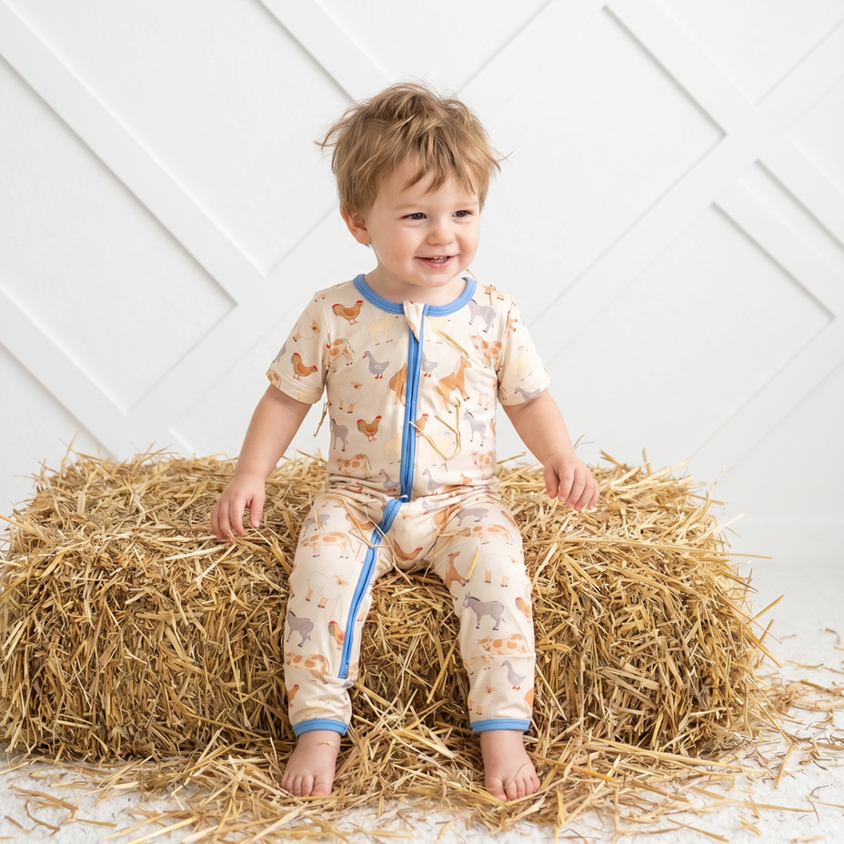 Baby convertible romper in whimsical Pasture Pals farm animal print with a two-way front zipper