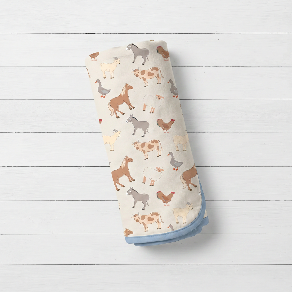 Swaddle blanket with Pasture Pals farm animal print, spread flat to show the oversized square shape