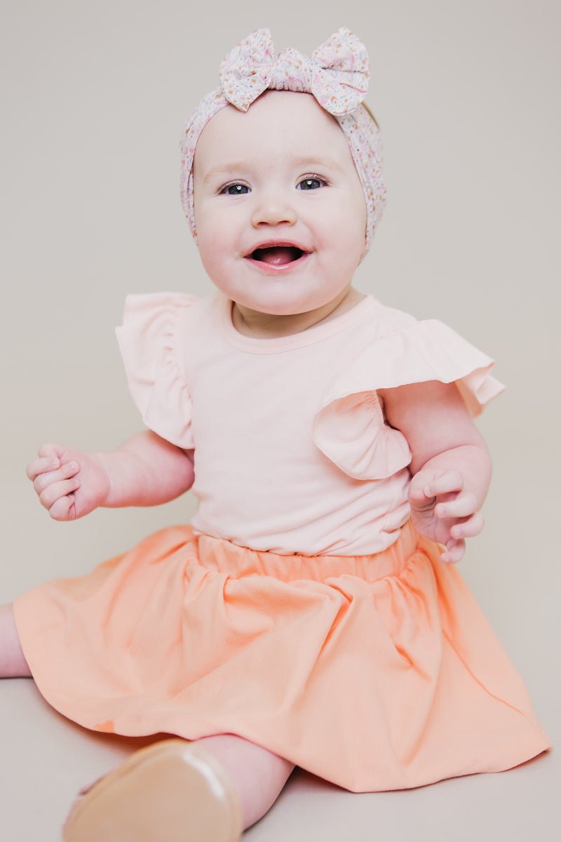 Mila & Rose ® Peach S/S Flutter BodysuitEveretts Place