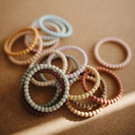 Mushie Pearl Teether Bracelet for Babies Non-Toxic Food-Grade Silicone Easy Grip Soothing Accessory -