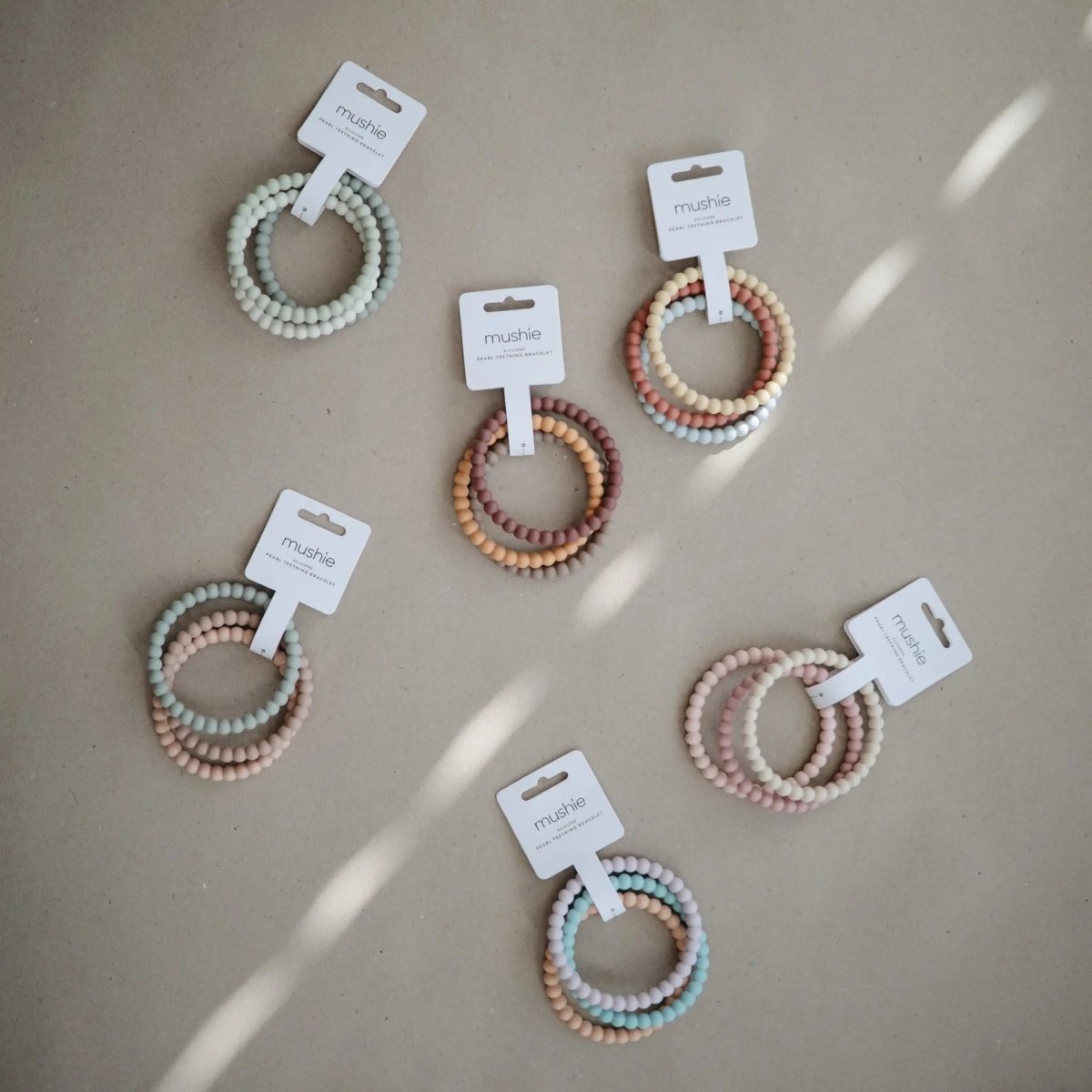 Mushie Pearl Teether Bracelet for Babies Non-Toxic Food-Grade Silicone Easy Grip Soothing Accessory -