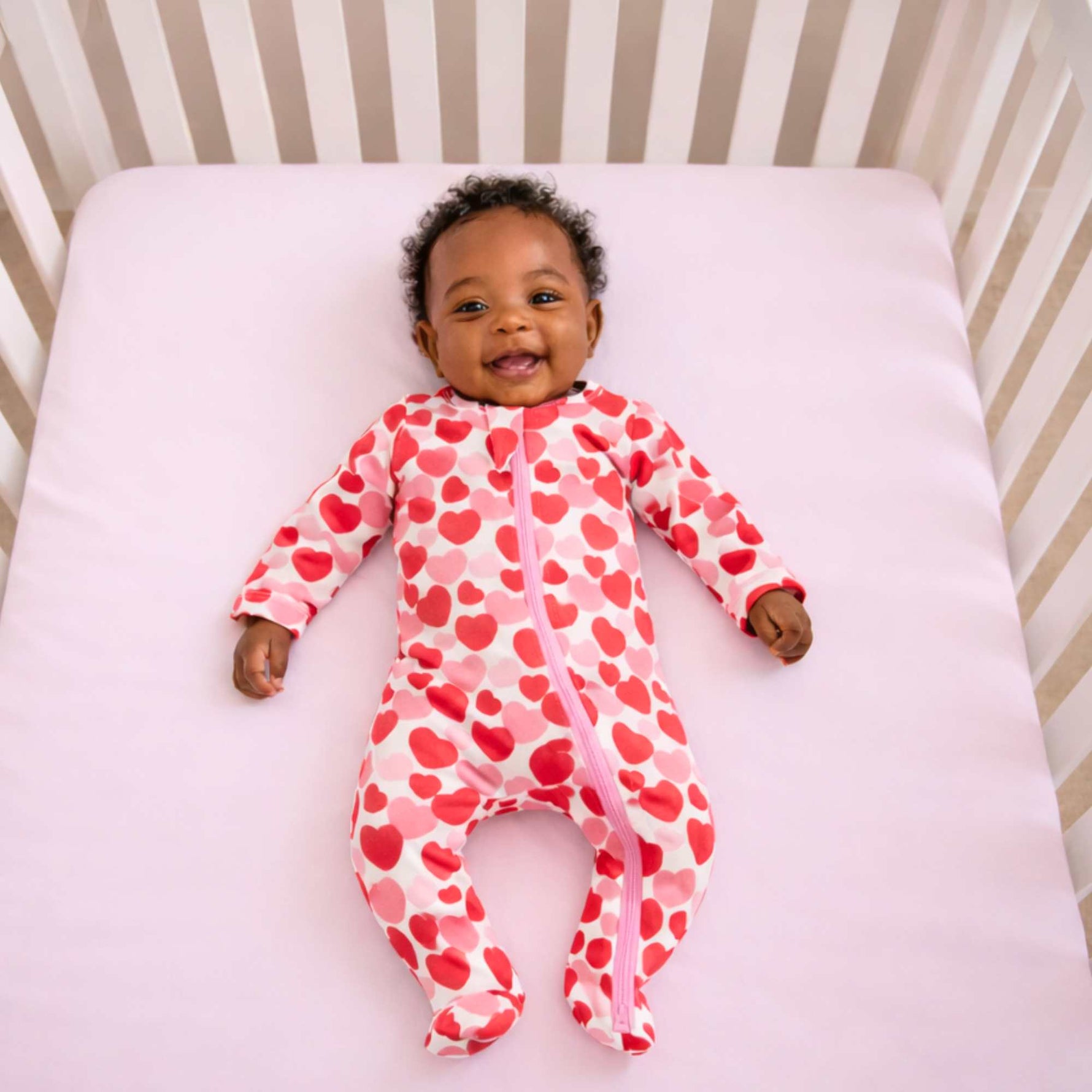 Norani Baby organic baby footie pajamas, red & pink hearts.