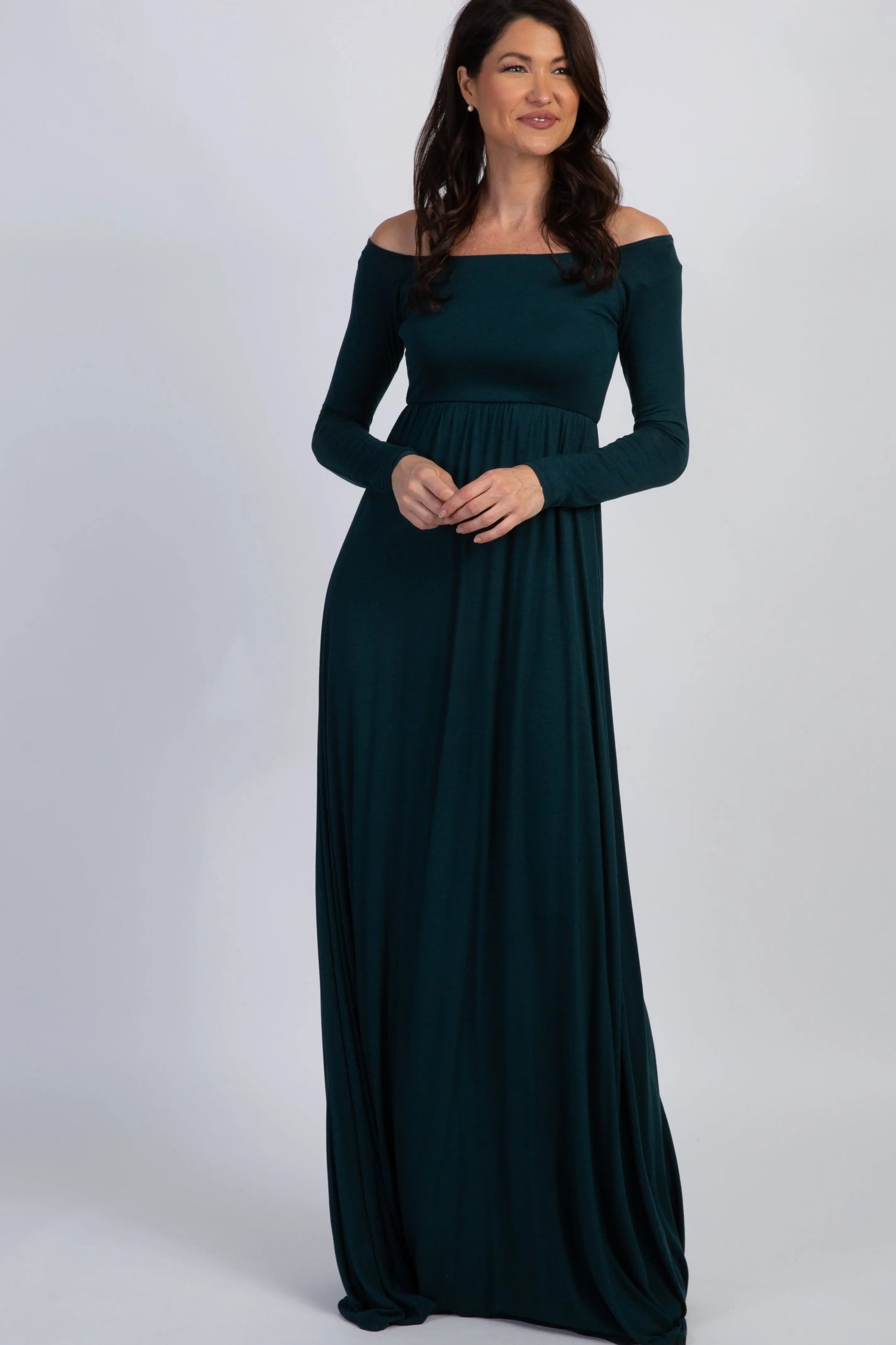 Forest green off shoulder maxi dress with a fitted bodice and long flowing skirt