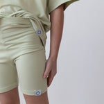 Toddler biker shorts in pistachio green with a fitted, stretchy design.