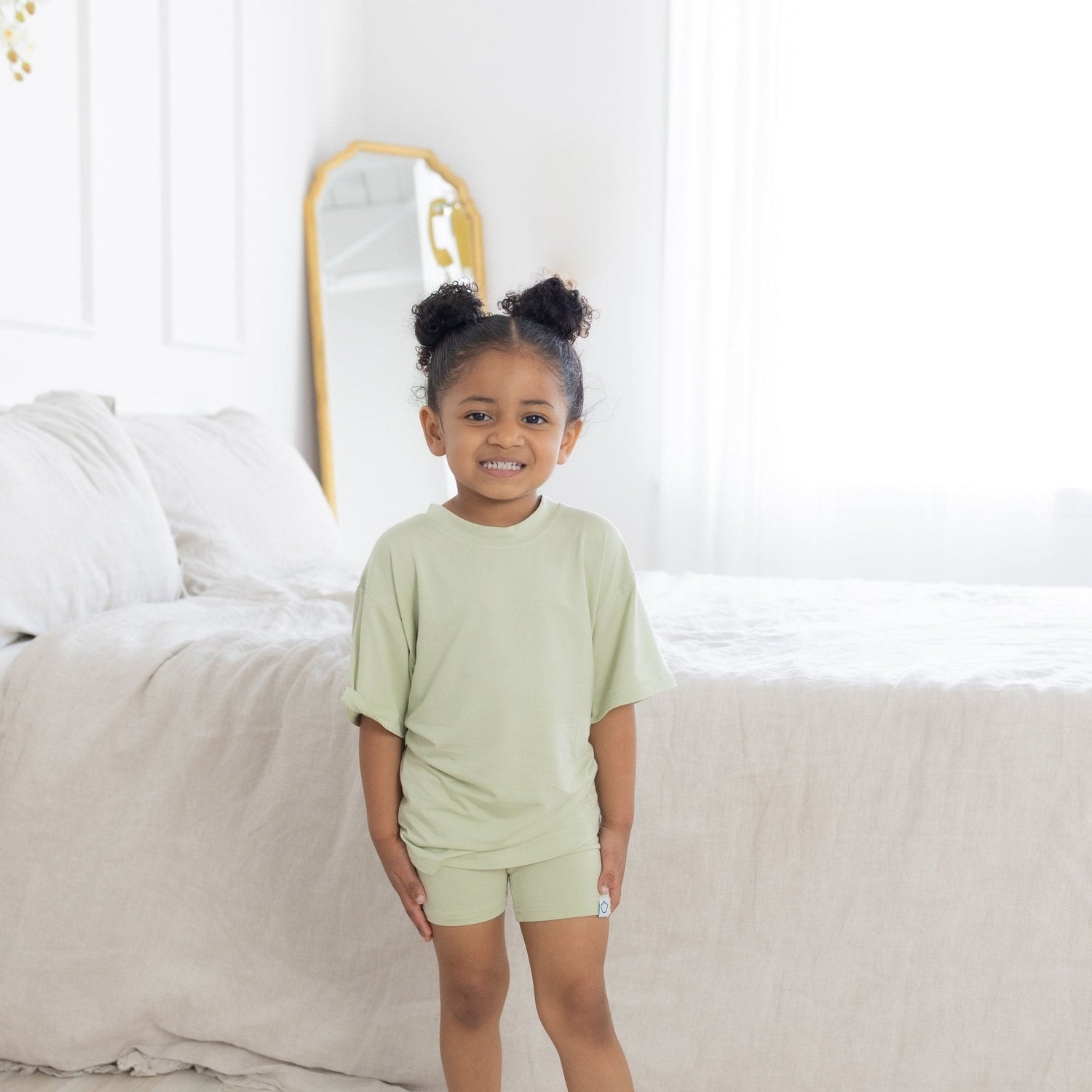 Pistachio green toddler short sleeve tee with a relaxed, oversized fit