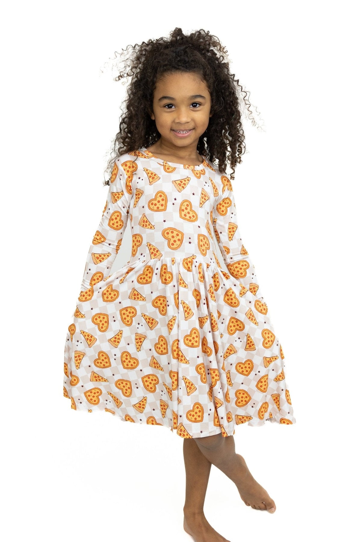 Long sleeve twirl dress in neutral checker print covered with heart-shaped pizzas