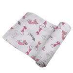 Soft bamboo muslin swaddle with a playful kitty pattern, perfect for baby's comfort and sleep.