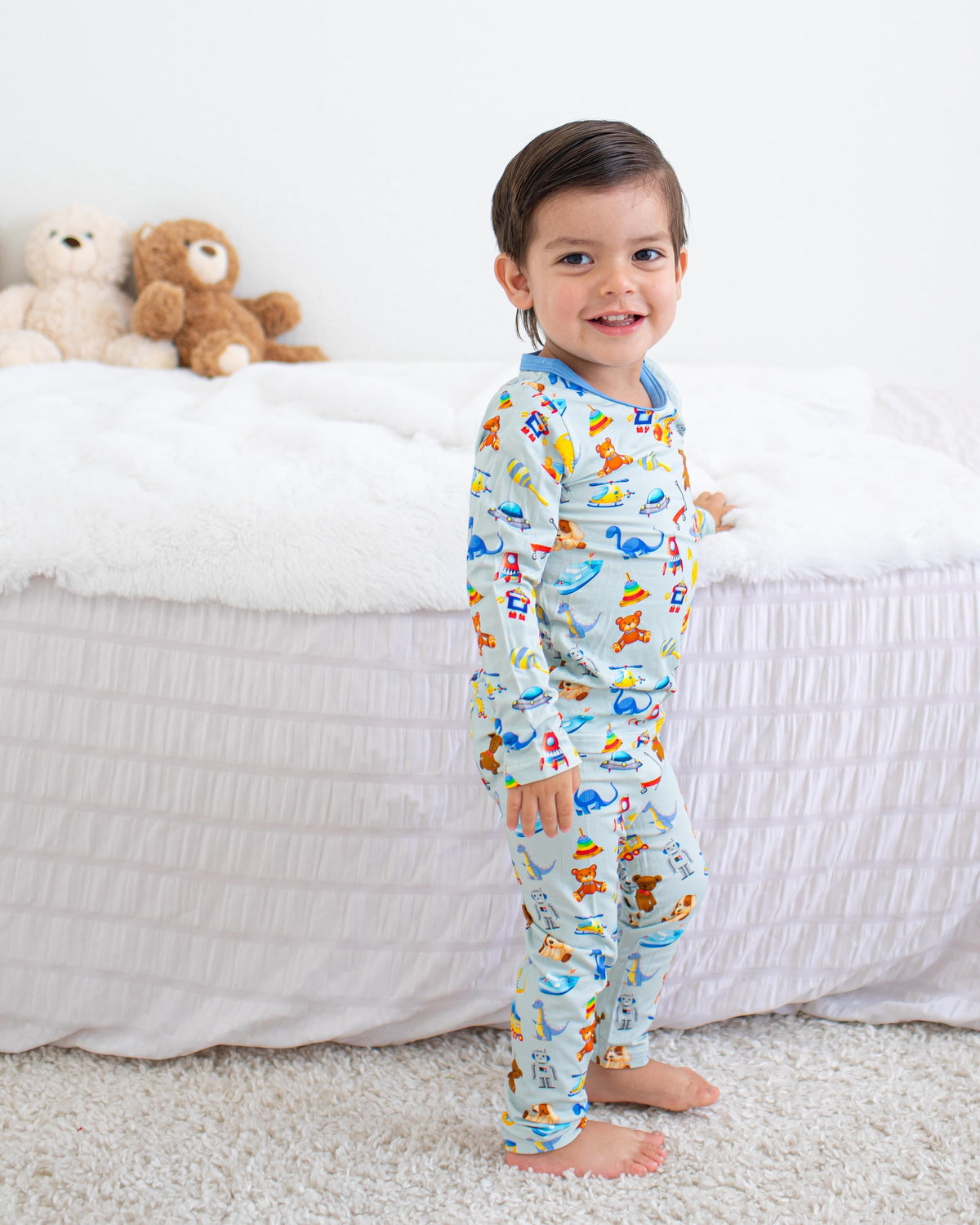 Two-piece long sleeve baby pajama set with playtime buddies print, matching top and pants