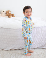 Two-piece long sleeve baby pajama set with playtime buddies print, matching top and pants