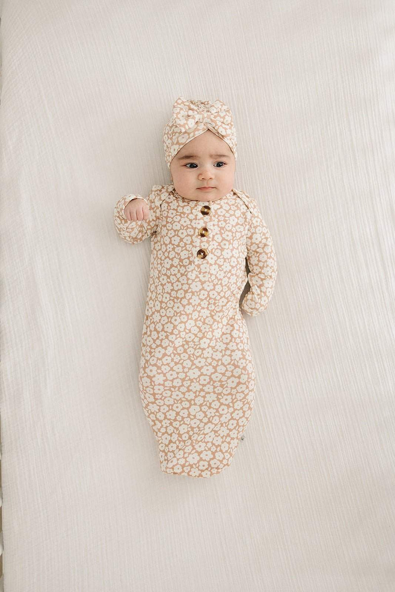 Knotted baby gown with mocha ditsy floral pattern in bamboo viscose with fold over cuffs.