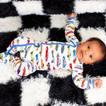 Baby footie pajamas with an all-over colorful race car print and a full-length two-way zipper.