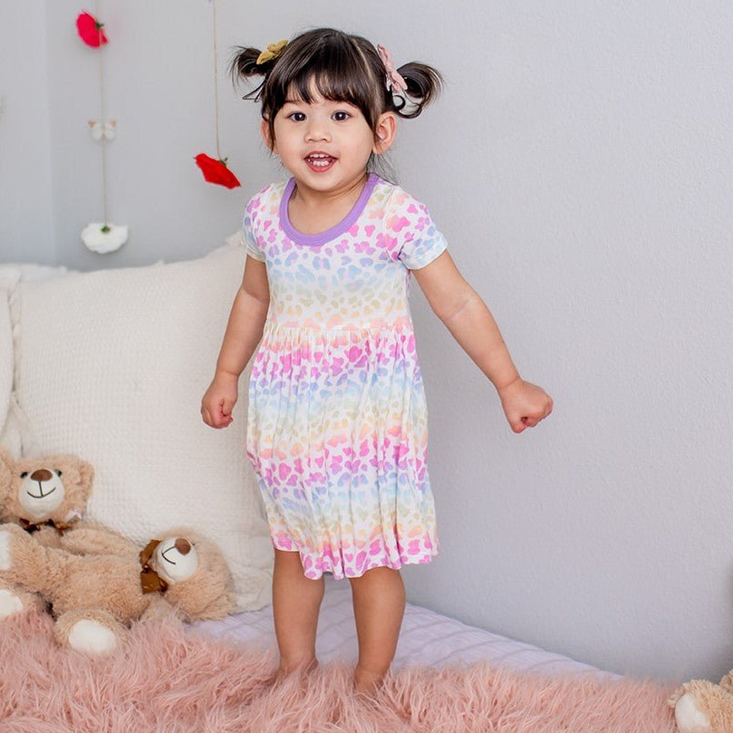 Pink short-sleeve toddler dress with a full skirt made for twirling