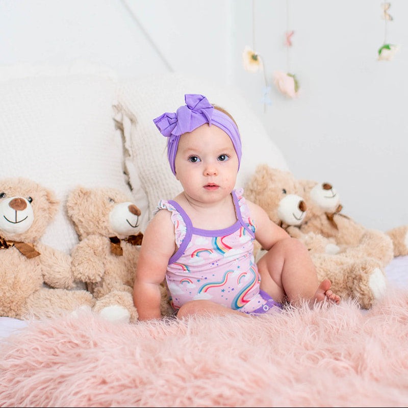 Baby bloomer set with ruffles on the back of the bloomer, matching bodysuit and headband
