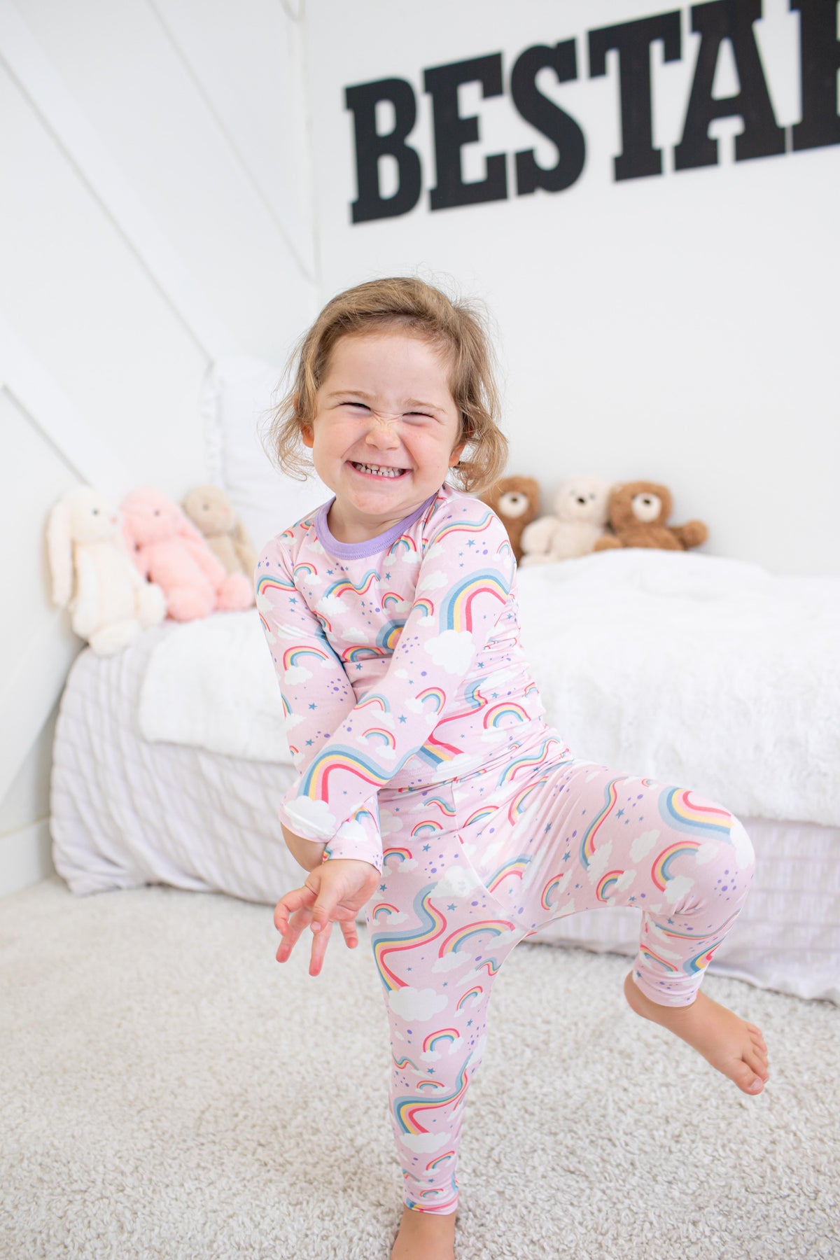 Two-piece long sleeve baby pajama set with rainbow print on the top and matching pants