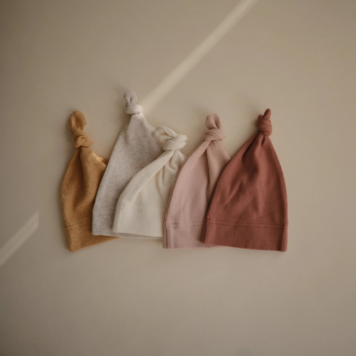 Mushie Ribbed Organic Cotton Baby Beanie for Newborns 0 - 3 Months with Top Knot Design - 