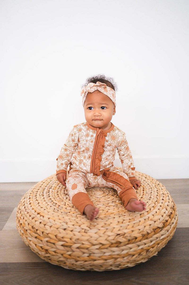 Ruffle Zipper One Piece with floral design, featuring a 2-way zipper and fold-over cuffs for baby comfort.