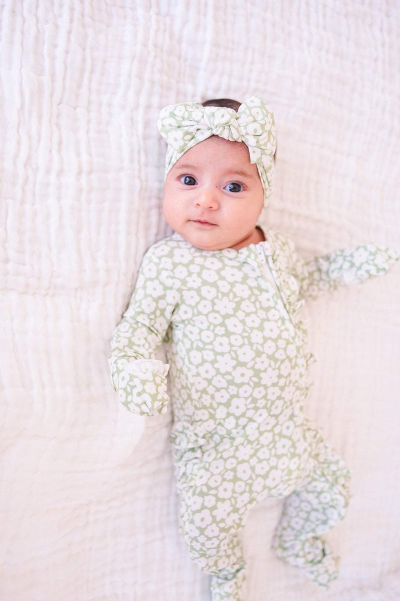 Ruffle Zipper One Piece in sage ditsy floral with ruffle details and 2-way zipper closure.
