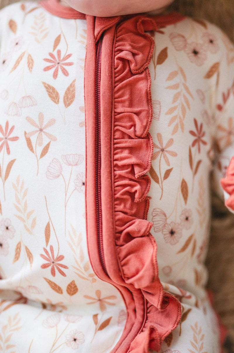 Wildflower ruffle zipper one piece with floral design and soft bamboo fabric.