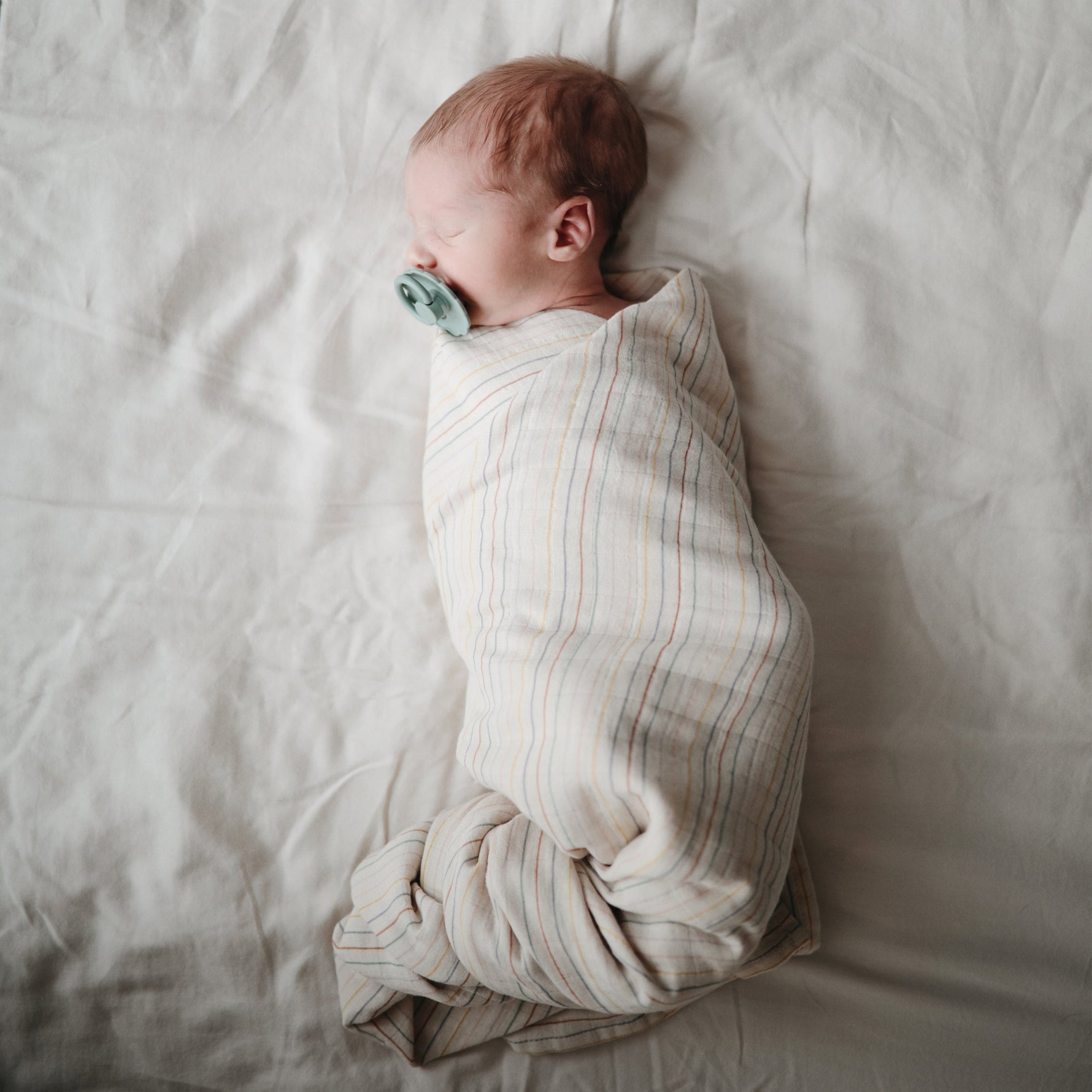 Mushie organic cotton muslin swaddle blanket