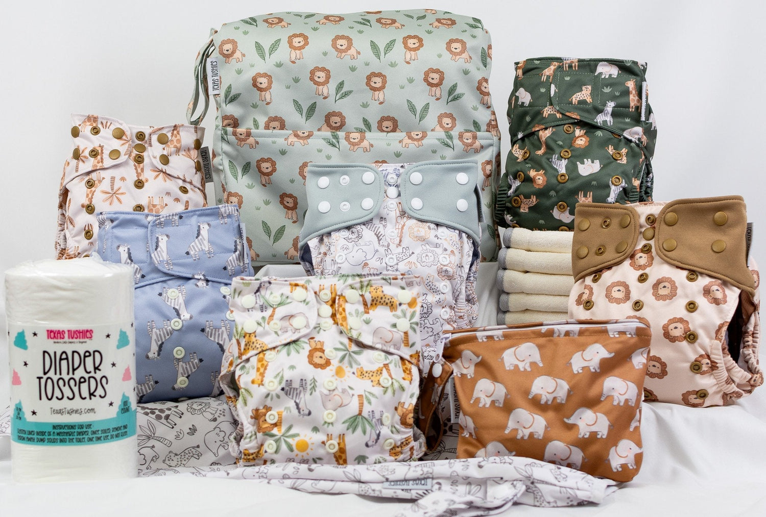 All-in-one cloth diaper starter bundle in a gender-neutral safari print with diapers and wet bags.