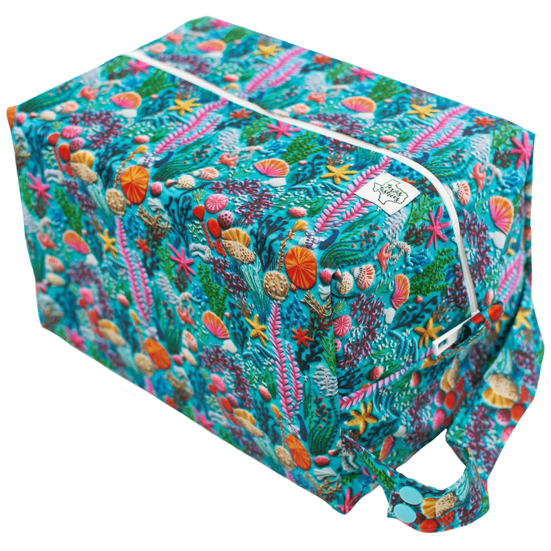 Sea Embroidery Pod with vibrant marine pattern and carry handle.