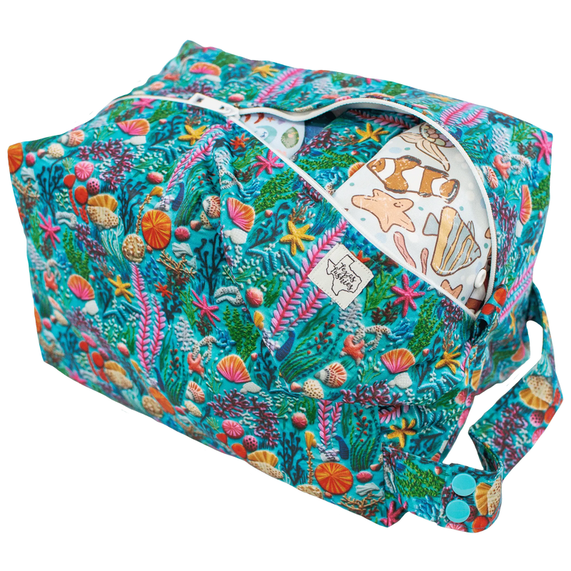 Sea Embroidery - Pod with ocean-themed print, snap handle, and zipper, holding up to 12 diapers.