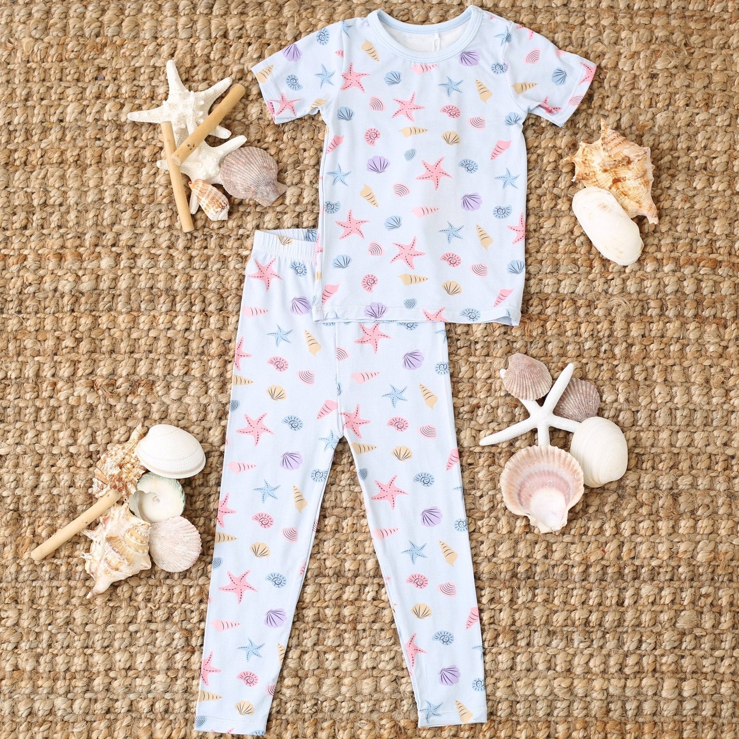 Short sleeve baby pajama set with pink and white seashell print top and matching pants