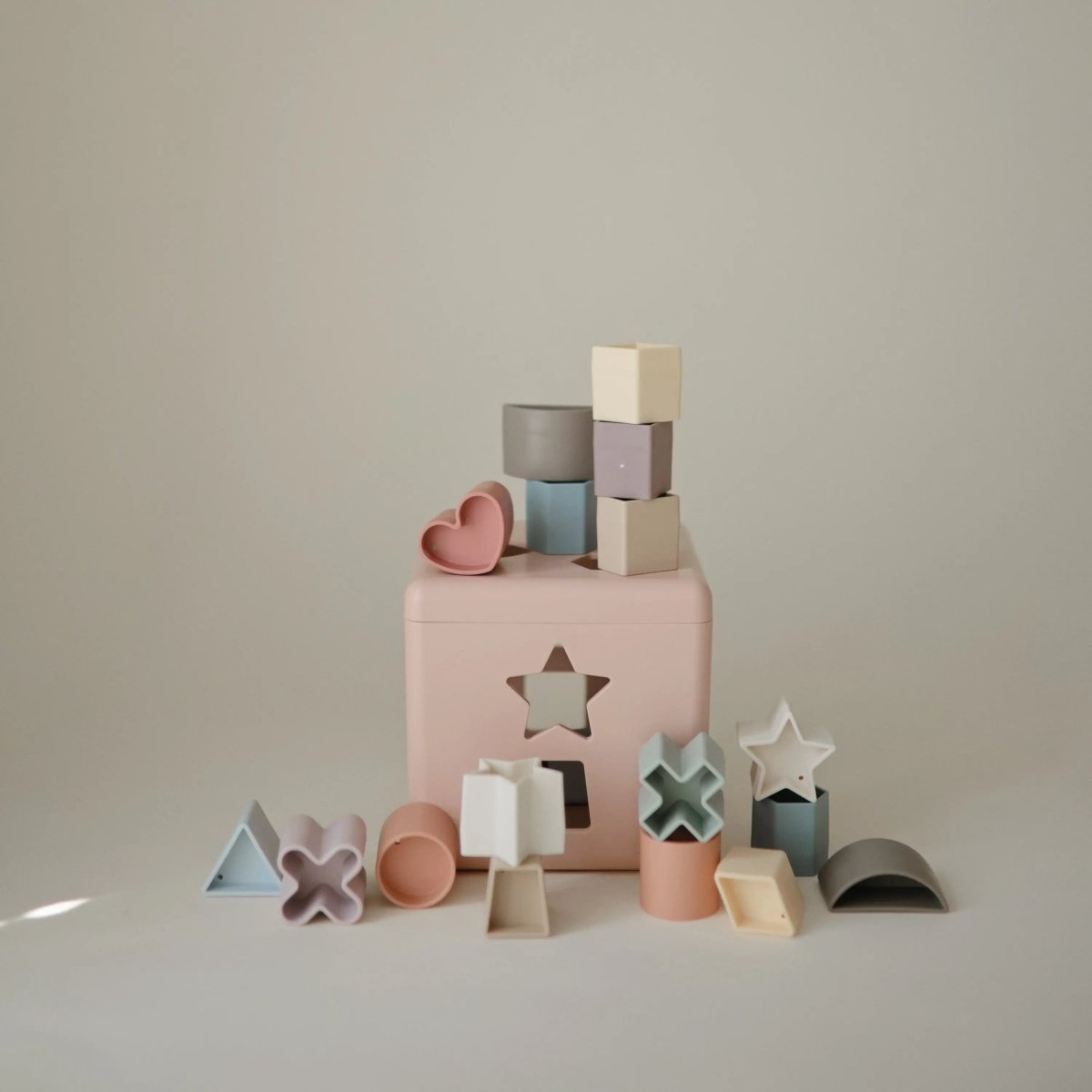 Mushie Shape Sorting Box for Kids Made in Denmark with 12 Soft Color Shapes for Fine Motor Skill Development -