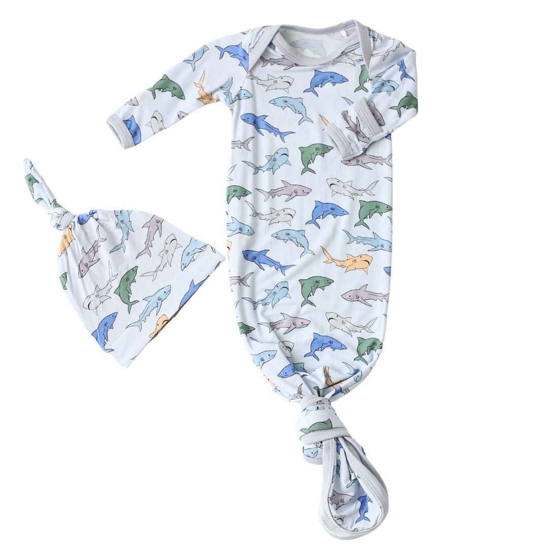 Baby gown and matching hat in a shark print, with fold-over mittens and a knotted bottom.