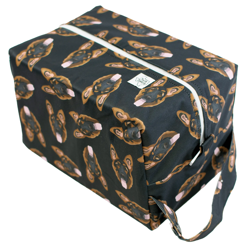 Shepard - Pod diaper bag with printed outer layer, zipper closure, and snap handle for versatile use.