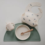 Mushie Silicone Baby Bib with Adjustable Neck Strap and Front Pocket for Easy Cleaning - 