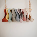 Mushie Silicone Baby Bib with Adjustable Neck Strap and Front Pocket for Easy Cleaning - 