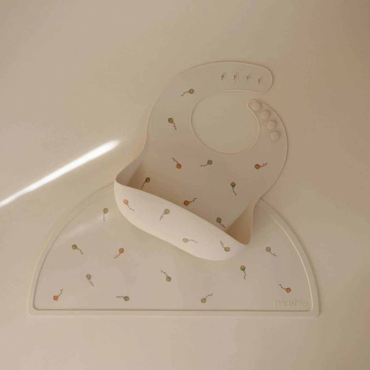 Mushie Silicone Baby Bib with Adjustable Neck Strap and Front Pocket for Easy Cleaning - 