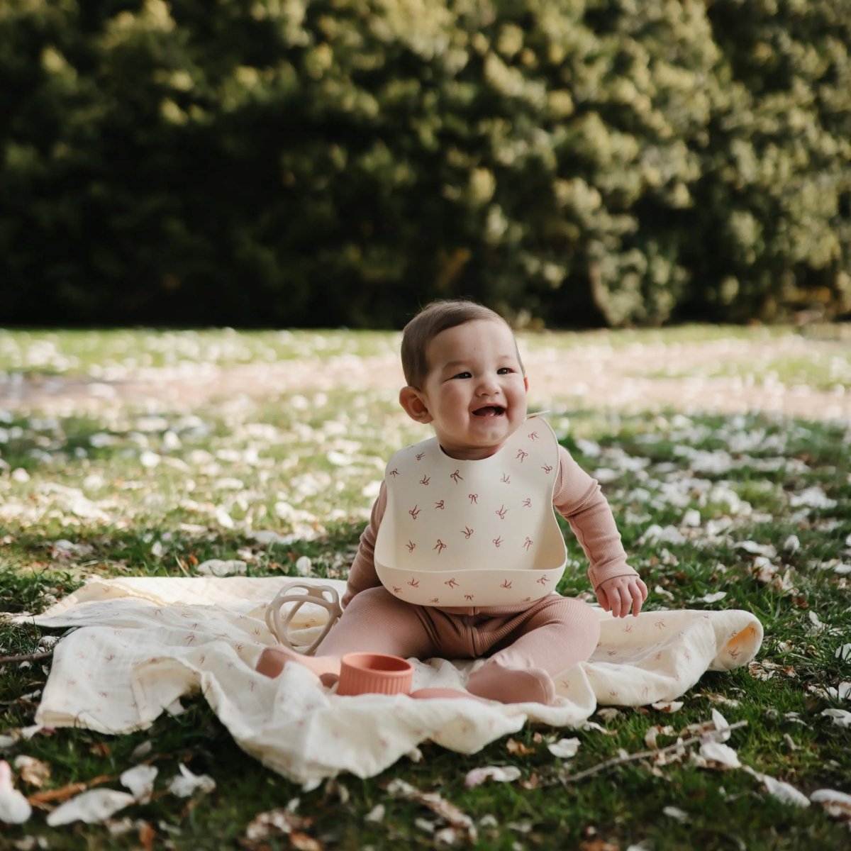 Mushie Silicone Baby Bib with Adjustable Neck Strap and Front Pocket for Easy Cleaning - 