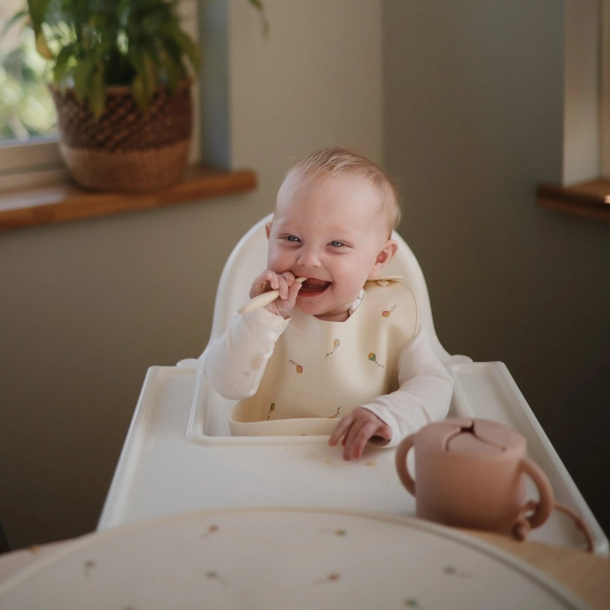 Mushie Silicone Baby Bib with Adjustable Neck Strap and Front Pocket for Easy Cleaning - 