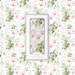 Soft organic baby swaddle blanket with a delicate silver pink orchid floral pattern, neatly folded.