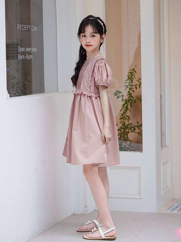 Plain pink cotton dress for young fashionistas, ideal summer wear.