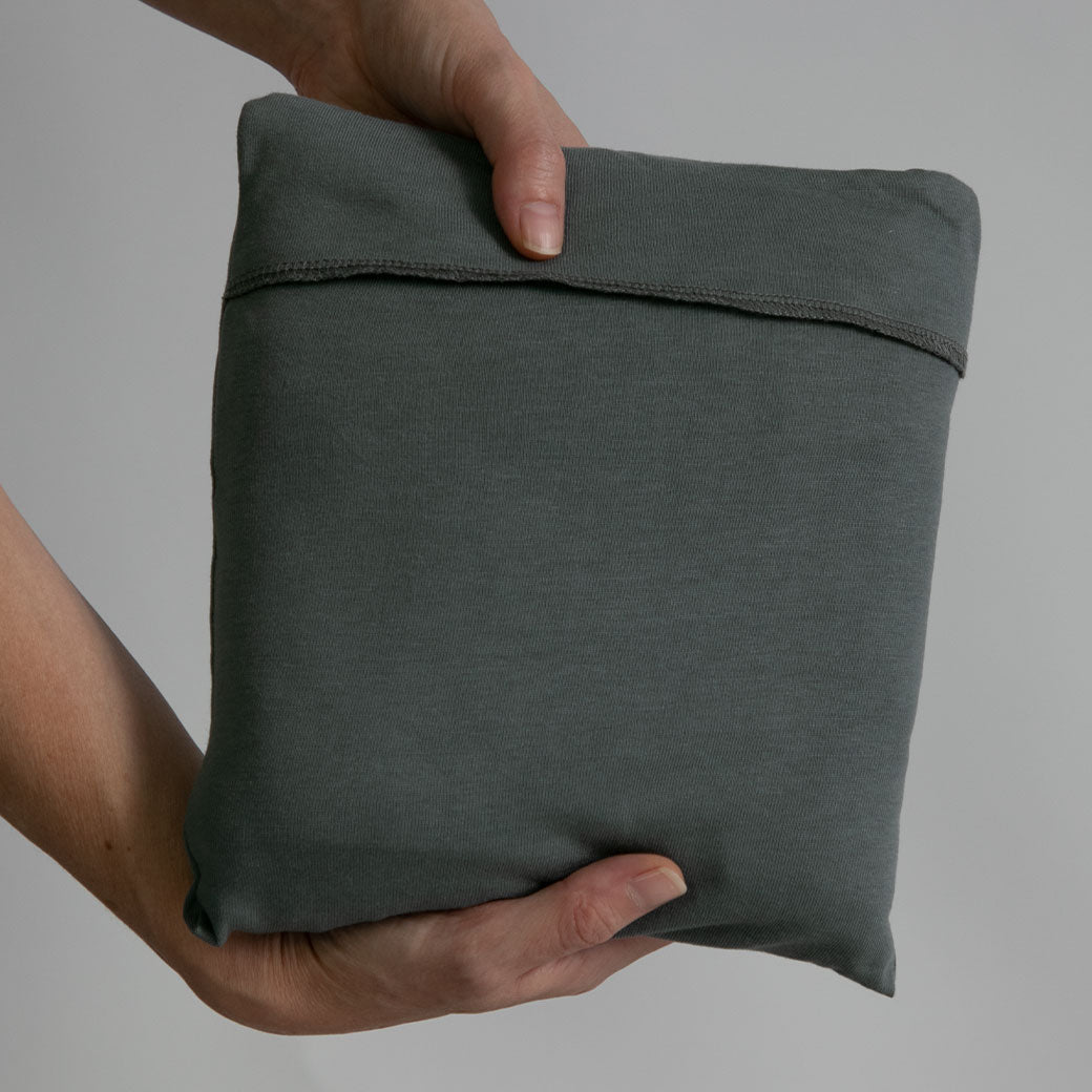 Modern Nursery organic cotton baby wrap for soft, secure infant carrying.