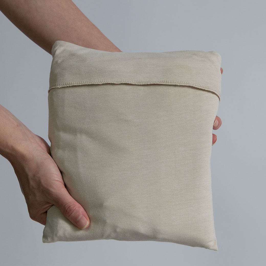 Modern Nursery organic cotton baby wrap. Soft, breathable, secure infant carrier.