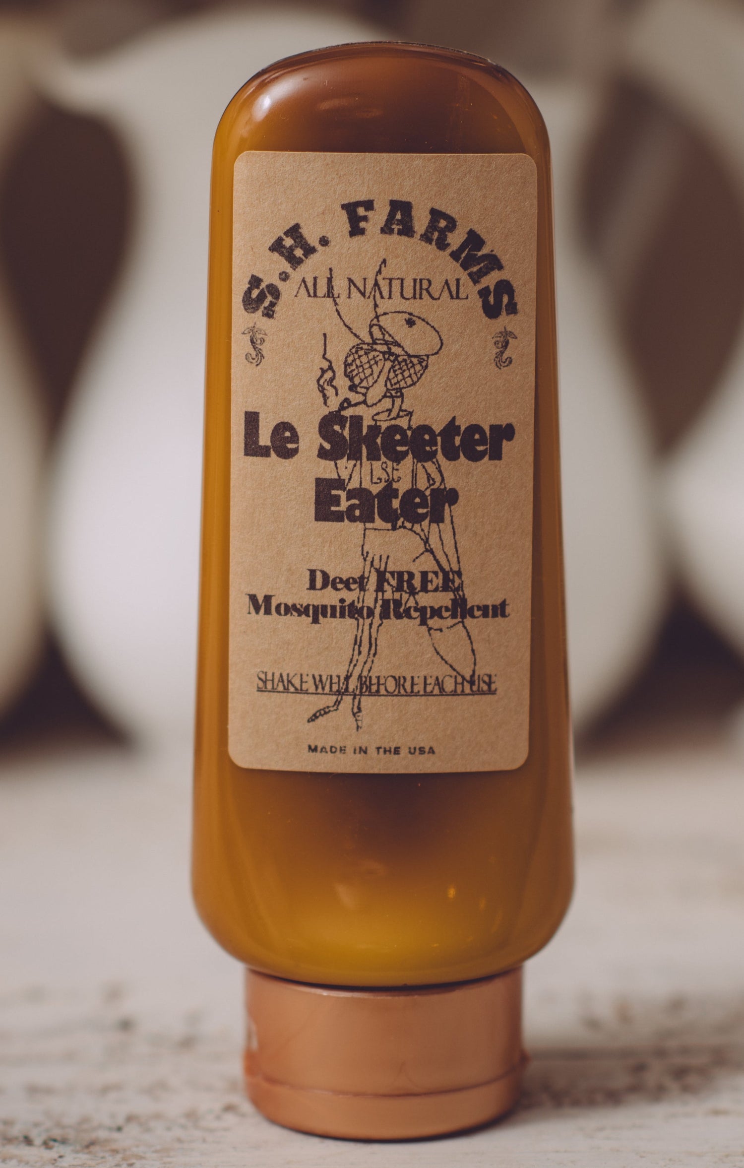Bottle of Le Skeeter Eater DEET-free organic mosquito repellent lotion by Sweet Harvest Farms
