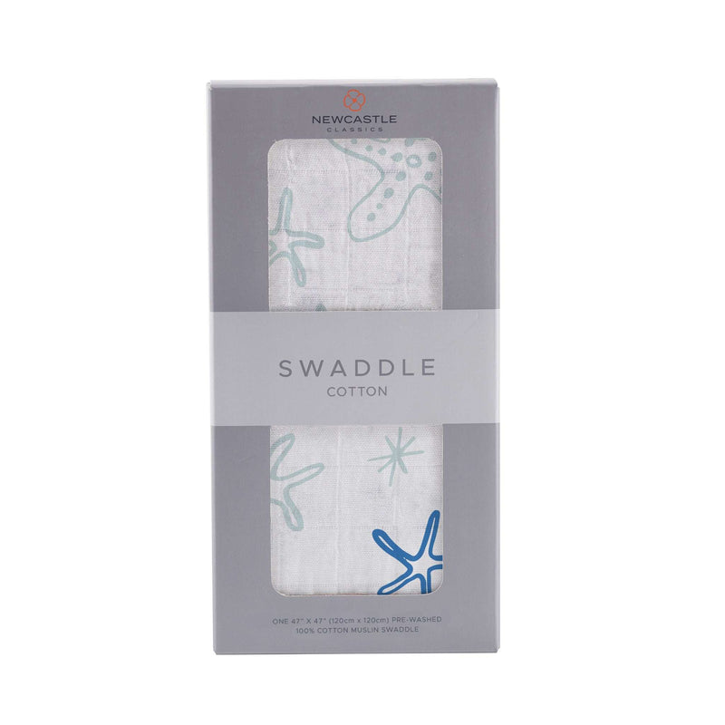 Starfish Cotton Muslin Swaddle in packaging, featuring breathable natural cotton.