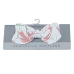 Baby headband in a water lily print with a bow detail