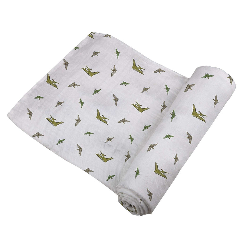Pteranodon cotton muslin swaddle with dinosaur print, soft and breathable.