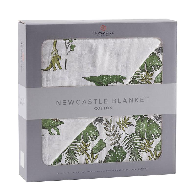 Dino Days and Tropical Forest Newcastle cotton muslin blanket in packaging, featuring green dinosaur and jungle pattern.